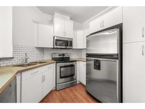 319-10 Discovery Ridge Close Sw, Calgary, AB - Indoor Photo Showing Kitchen With Double Sink