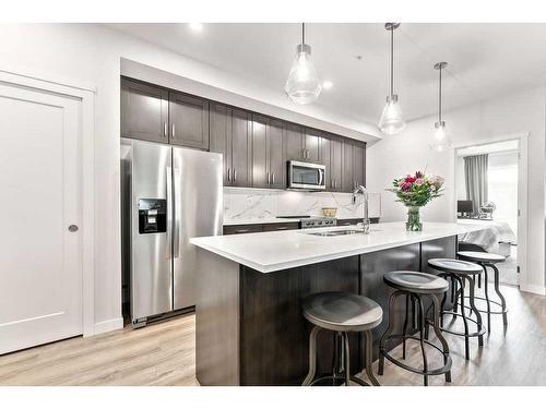 506-71 Shawnee Common Sw, Calgary, AB - Indoor Photo Showing Kitchen With Stainless Steel Kitchen With Upgraded Kitchen