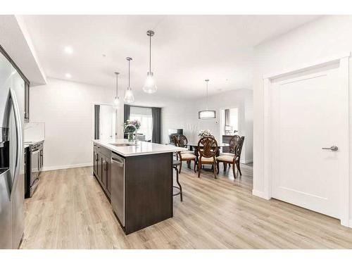 506-71 Shawnee Common Sw, Calgary, AB - Indoor Photo Showing Kitchen With Upgraded Kitchen