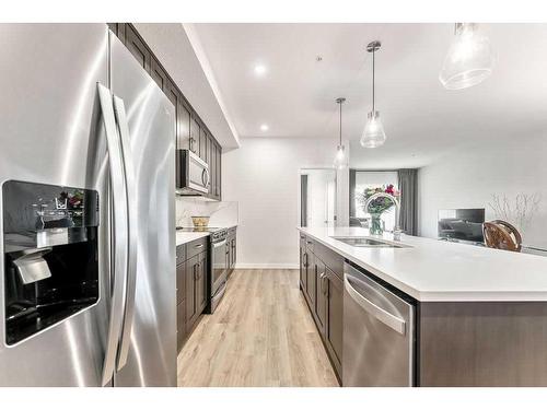 506-71 Shawnee Common Sw, Calgary, AB - Indoor Photo Showing Kitchen With Stainless Steel Kitchen With Upgraded Kitchen