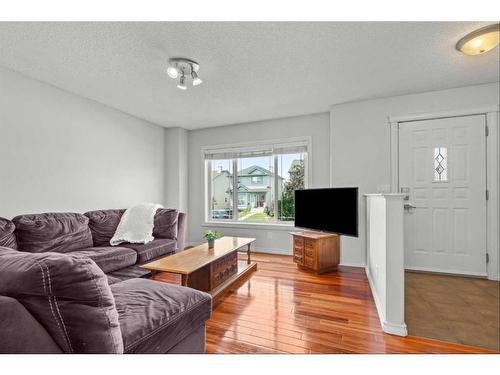 9 Crystal Shores Hill, Okotoks, AB - Indoor Photo Showing Living Room