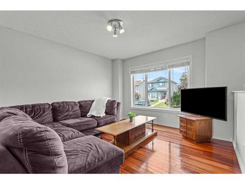 9 Crystal Shores Hill, Okotoks, AB - Indoor Photo Showing Living Room