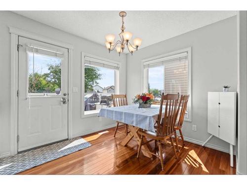 9 Crystal Shores Hill, Okotoks, AB - Indoor Photo Showing Dining Room