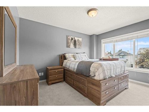 9 Crystal Shores Hill, Okotoks, AB - Indoor Photo Showing Bedroom