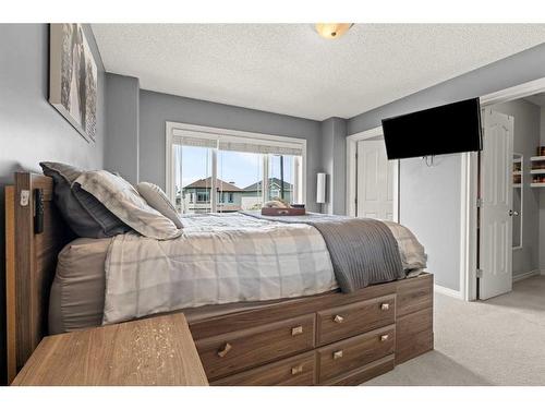 9 Crystal Shores Hill, Okotoks, AB - Indoor Photo Showing Bedroom