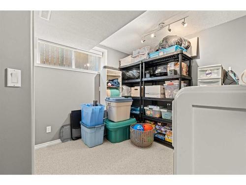 9 Crystal Shores Hill, Okotoks, AB - Indoor Photo Showing Laundry Room