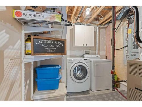 9 Crystal Shores Hill, Okotoks, AB - Indoor Photo Showing Laundry Room