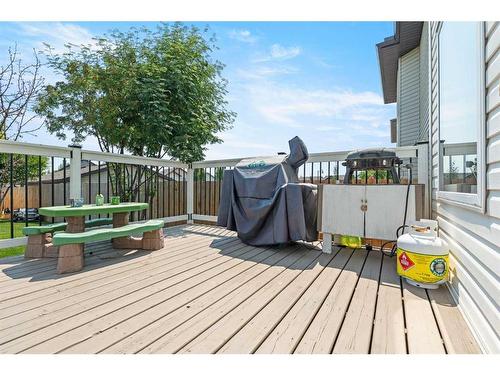 9 Crystal Shores Hill, Okotoks, AB - Outdoor With Deck Patio Veranda With Exterior