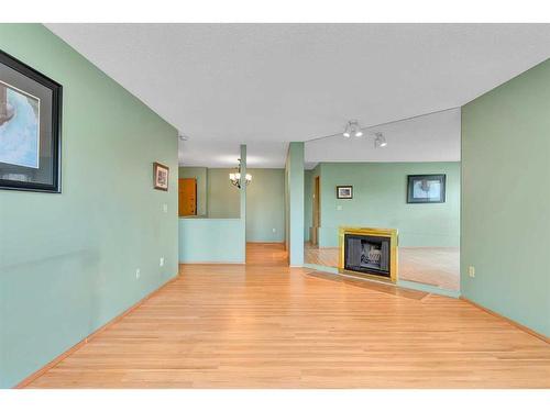 306-335 Garry Crescent Ne, Calgary, AB - Indoor With Fireplace