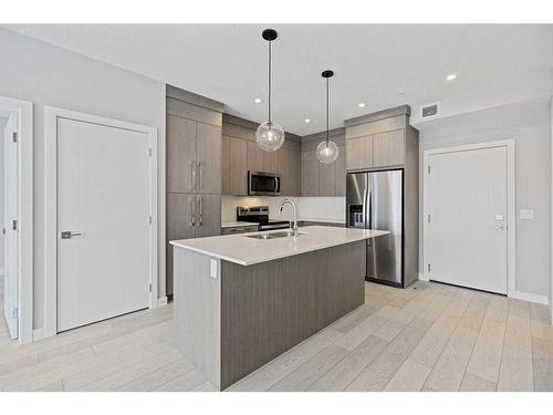 1402-681 Savanna Boulevard Ne, Calgary, AB - Indoor Photo Showing Kitchen With Stainless Steel Kitchen