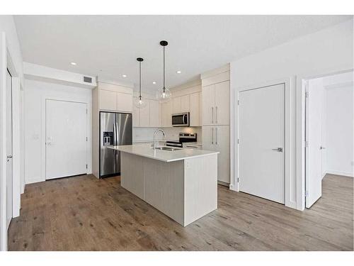 1402-681 Savanna Boulevard Ne, Calgary, AB - Indoor Photo Showing Kitchen With Stainless Steel Kitchen