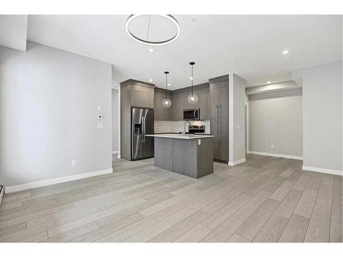 1402-681 Savanna Boulevard Ne, Calgary, AB - Indoor Photo Showing Kitchen With Stainless Steel Kitchen