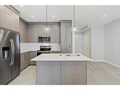 1402-681 Savanna Boulevard Ne, Calgary, AB - Indoor Photo Showing Kitchen With Stainless Steel Kitchen With Upgraded Kitchen