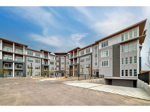 1402-681 Savanna Boulevard Ne, Calgary, AB - Outdoor With Balcony With Facade