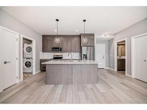 1402-681 Savanna Boulevard Ne, Calgary, AB - Indoor Photo Showing Kitchen