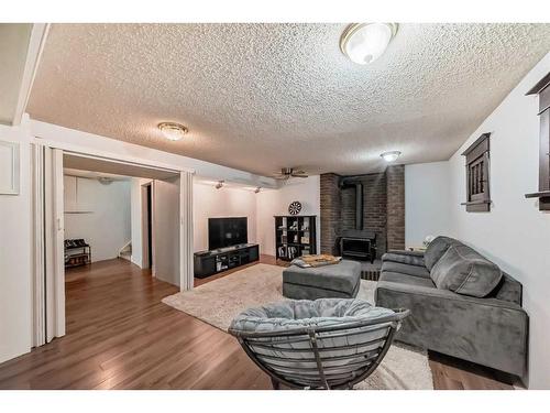3379 Breton Close Nw, Calgary, AB - Indoor Photo Showing Living Room With Fireplace