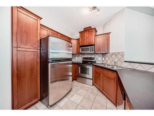 214-20 Discovery Ridge Close Sw, Calgary, AB - Indoor Photo Showing Kitchen With Stainless Steel Kitchen With Double Sink