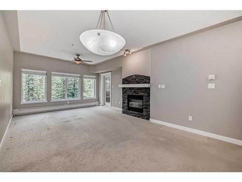 214-20 Discovery Ridge Close Sw, Calgary, AB - Indoor With Fireplace