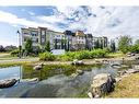 308-38 Quarry Gate Se, Calgary, AB  - Outdoor With Body Of Water With View 