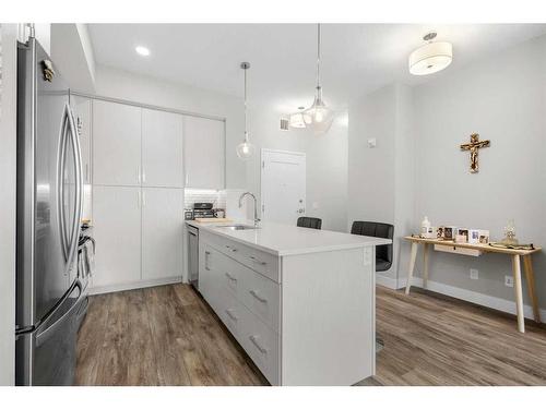 308-38 Quarry Gate Se, Calgary, AB - Indoor Photo Showing Kitchen