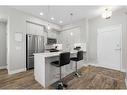 308-38 Quarry Gate Se, Calgary, AB  - Indoor Photo Showing Kitchen With Upgraded Kitchen 