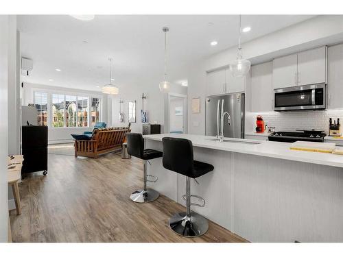 308-38 Quarry Gate Se, Calgary, AB - Indoor Photo Showing Kitchen With Upgraded Kitchen