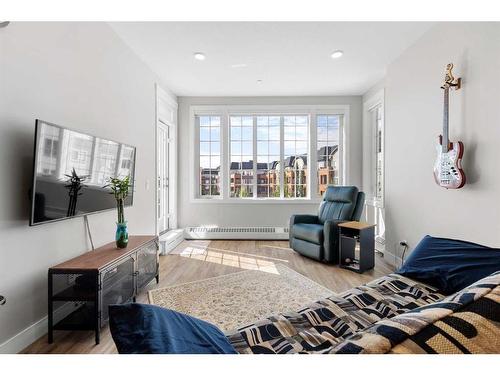 308-38 Quarry Gate Se, Calgary, AB - Indoor Photo Showing Living Room