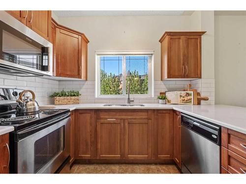 404-20 Discovery Ridge Close Sw, Calgary, AB - Indoor Photo Showing Kitchen With Double Sink