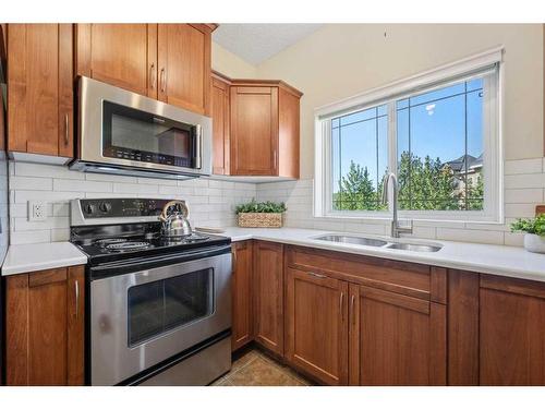 404-20 Discovery Ridge Close Sw, Calgary, AB - Indoor Photo Showing Kitchen With Double Sink