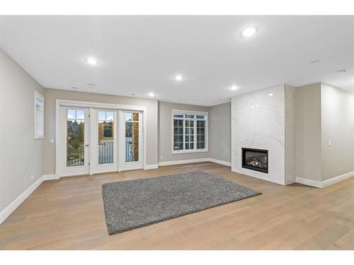 11 Elveden Place Sw, Calgary, AB - Indoor With Fireplace