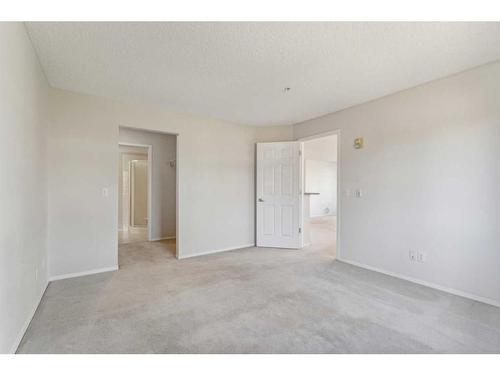 1203-928 Arbour Lake Road Nw, Calgary, AB - Indoor Photo Showing Other Room