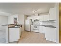 1203-928 Arbour Lake Road Nw, Calgary, AB  - Indoor Photo Showing Kitchen 