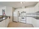 1203-928 Arbour Lake Road Nw, Calgary, AB  - Indoor Photo Showing Kitchen With Double Sink 