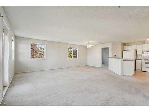 1203-928 Arbour Lake Road Nw, Calgary, AB - Indoor Photo Showing Kitchen