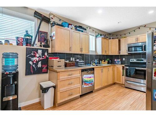 216 Windsor Avenue Nw, Diamond Valley, AB - Indoor Photo Showing Kitchen With Stainless Steel Kitchen