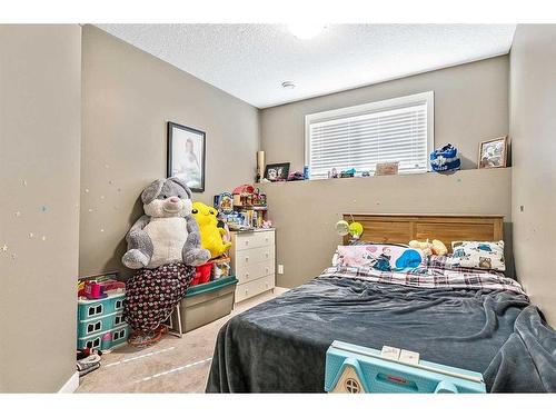 216 Windsor Avenue Nw, Diamond Valley, AB - Indoor Photo Showing Bedroom