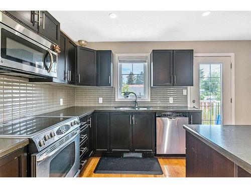 216 Windsor Avenue Nw, Diamond Valley, AB - Indoor Photo Showing Kitchen With Stainless Steel Kitchen With Double Sink With Upgraded Kitchen