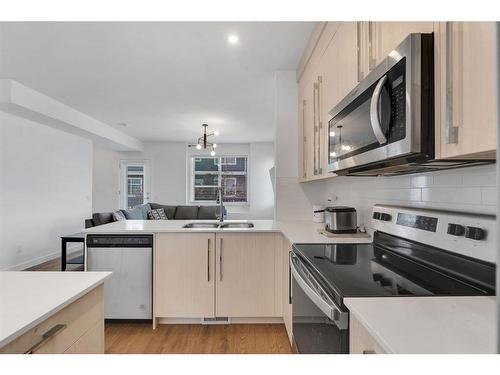 507-50 Cornerstone Passage Ne, Calgary, AB - Indoor Photo Showing Kitchen With Stainless Steel Kitchen With Double Sink