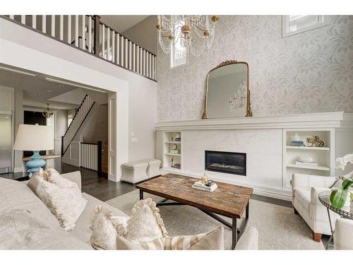 71 Aspen Dale Way Sw, Calgary, AB - Indoor Photo Showing Living Room With Fireplace