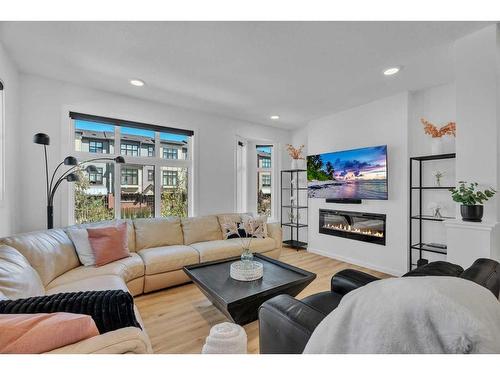 83 Spring Willow Close Sw, Calgary, AB - Indoor Photo Showing Living Room With Fireplace