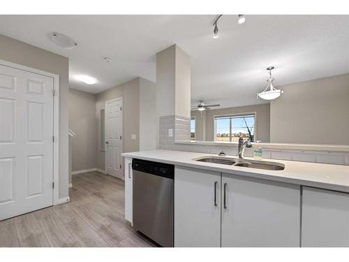 20 Cityside Park Ne, Calgary, AB - Indoor Photo Showing Kitchen With Double Sink