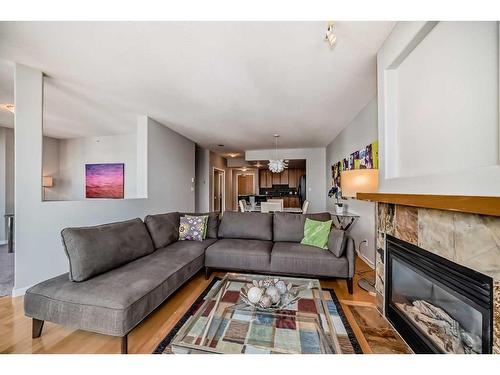 2203-1078 6 Avenue Sw, Calgary, AB - Indoor Photo Showing Living Room With Fireplace