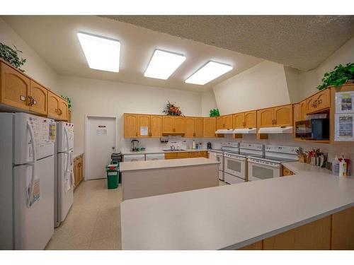 1102-1000 Hawksbrow Point Nw, Calgary, AB - Indoor Photo Showing Kitchen