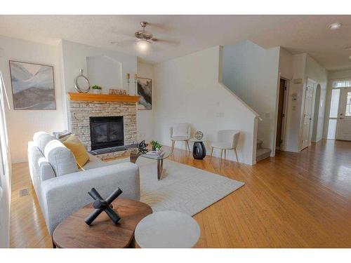 174 Prestwick Estate Way Se, Calgary, AB - Indoor Photo Showing Living Room With Fireplace