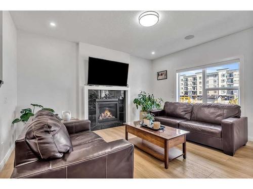 224 Dawson Harbour Heights, Chestermere, AB - Indoor Photo Showing Living Room With Fireplace