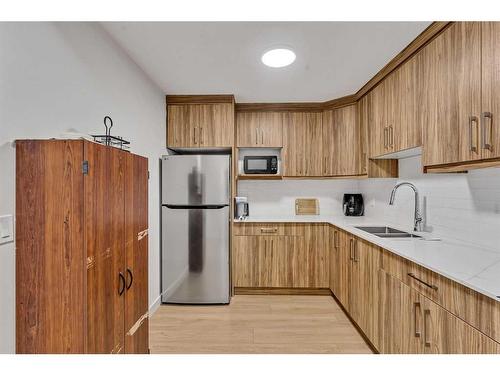 224 Dawson Harbour Heights, Chestermere, AB - Indoor Photo Showing Kitchen With Double Sink