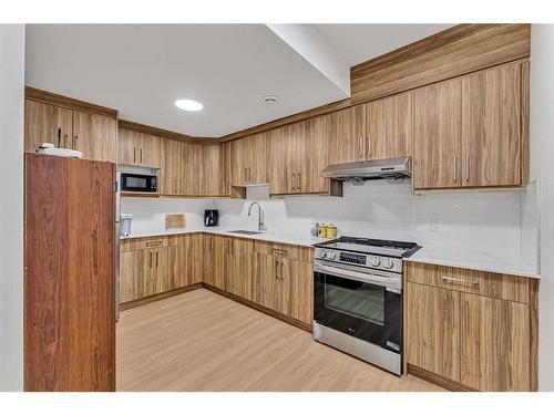 224 Dawson Harbour Heights, Chestermere, AB - Indoor Photo Showing Kitchen