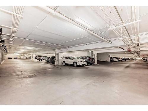 301-8710 Horton Road Sw, Calgary, AB - Indoor Photo Showing Garage