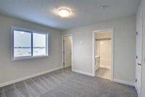 157 Cobblestone Gate Sw, Airdrie, AB - Indoor Photo Showing Other Room