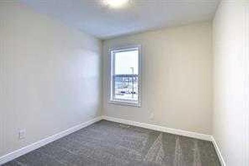 157 Cobblestone Gate Sw, Airdrie, AB - Indoor Photo Showing Other Room